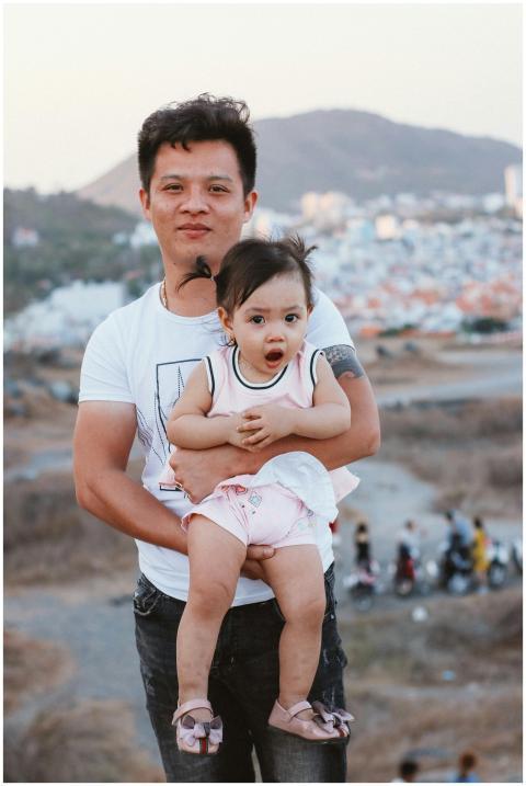 Father and daughter enjoying a sunny day outdoors,