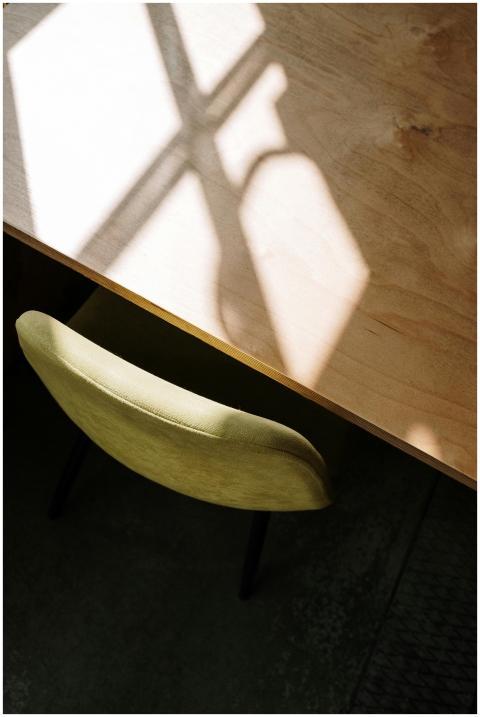 Top-down view of a modern wooden table and yellow