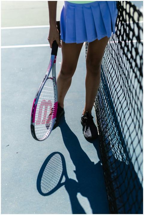 Close-up of a female tennis player holding a racke