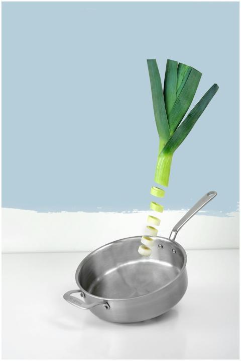 Artistic presentation of a sliced leek over a stai