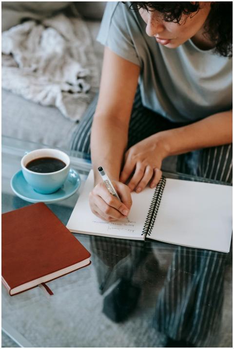 From above of crop young female student in casual