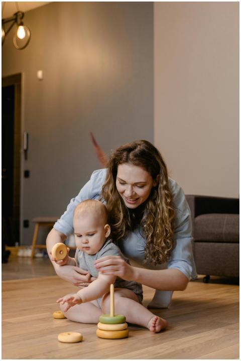 A mother and baby enjoying playtime with wooden to
