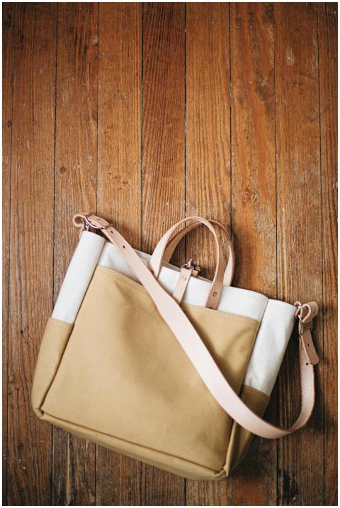 Minimalist canvas tote bag with leather accents on
