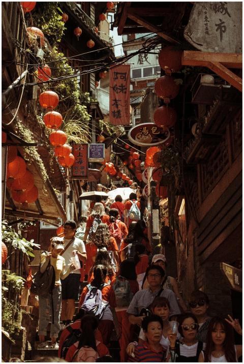 A bustling street filled with people and red Chine