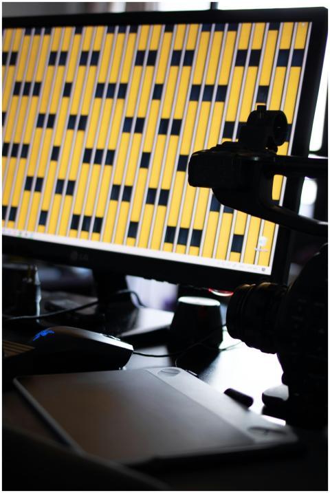 A well-equipped workspace featuring a monitor disp