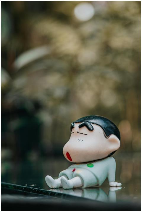 Playful Figurine Resting Reflective