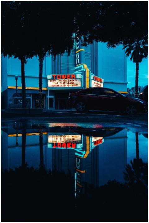 Night scene with vintage car reflections in a neon