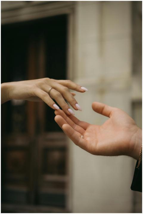 Close-up of two hands reaching out, symbolizing co