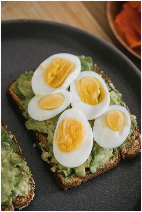 High-angle view of avocado toast topped with boile