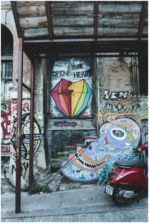 Colorful street art mural featuring graffiti and a