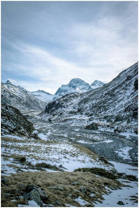 Striking view of snow-capped mountains and a froze