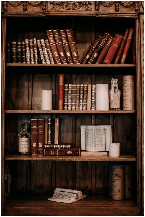 Vintage books and rustic decor on a wooden bookshe