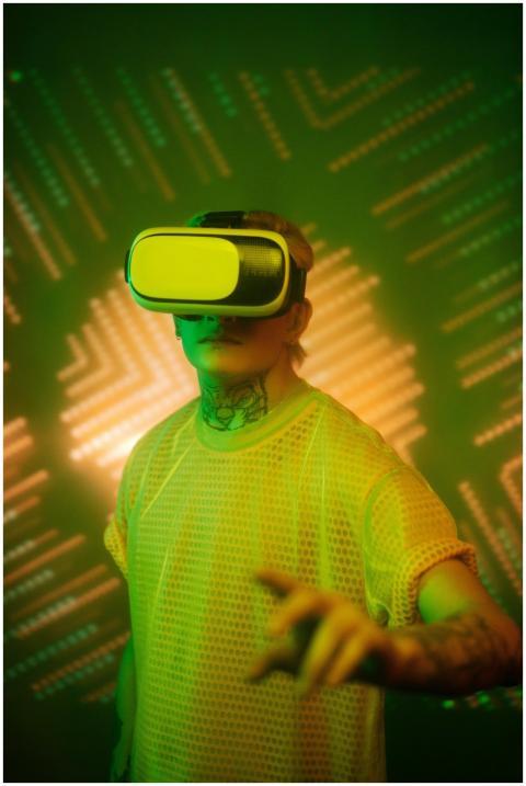 A man wearing VR goggles immersed in a vibrant vir