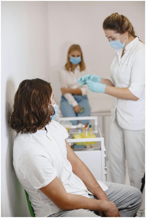 Medical professionals performing a blood test in a