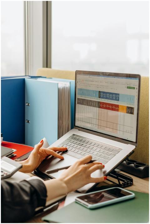 Business workspace with folders and laptop showing