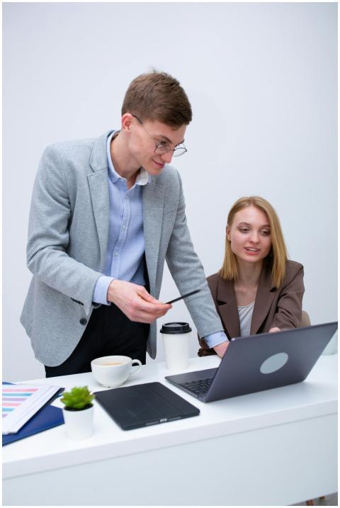 Two business professionals collaborating at a desk