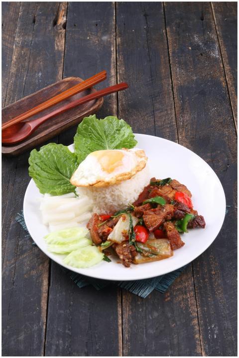 Thai basil chicken with rice, fried egg, and fresh
