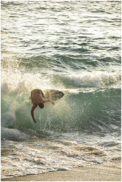 Experience the thrill of surfing a powerful ocean