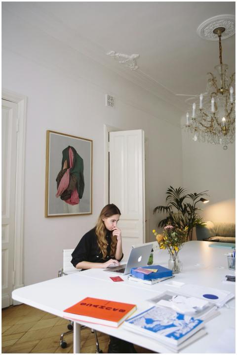 Modern home office featuring a woman working on a