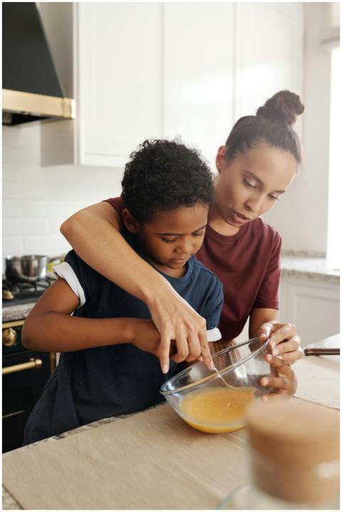 A mother and her young son bonding while preparing