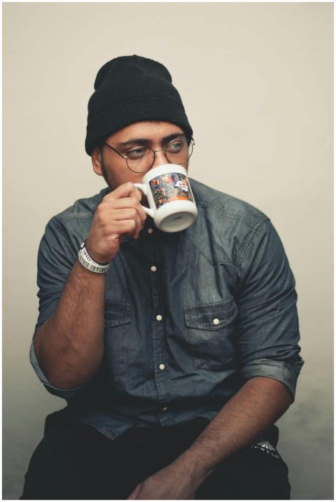 Casual portrait of a man wearing a beanie and eyeg