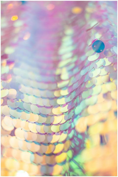 Abstract close-up of iridescent sequins creating a