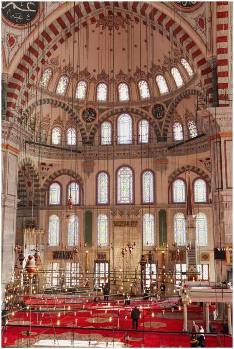 A stunning view of an ornate mosque interior with