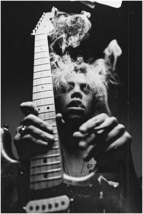 Artistic black and white portrait of a man playing