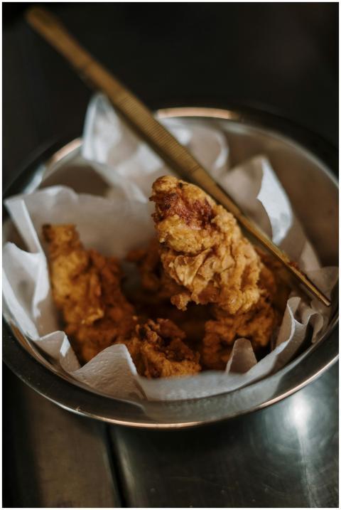 Close-up of crispy fried chicken in a bowl with a