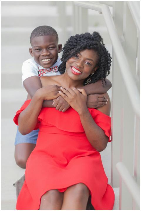 A cheerful African American mother and son share a