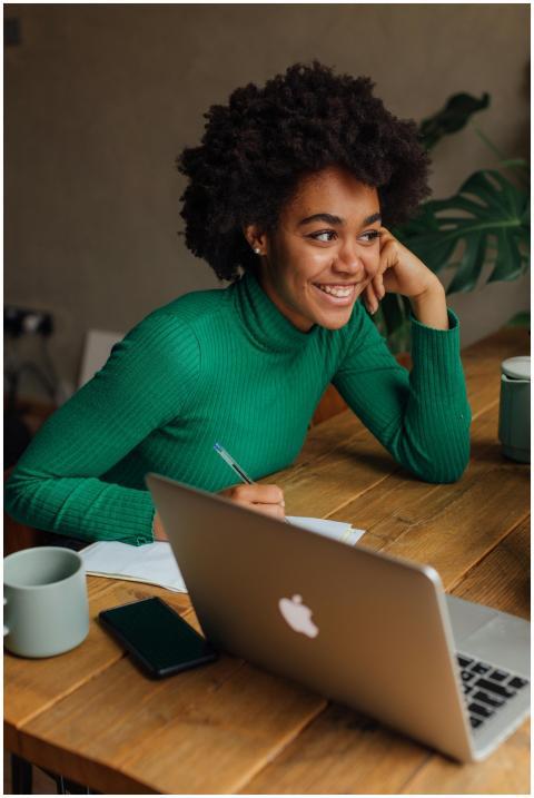 African American woman with afro hair smiling whil