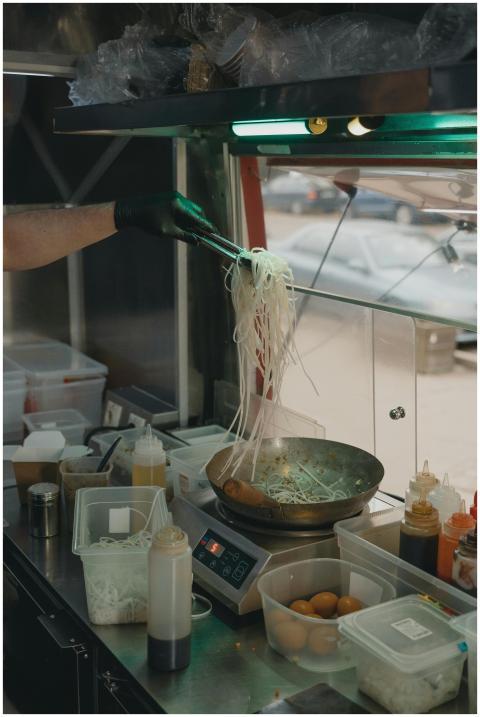 Culinary scene with noodles being cooked inside a