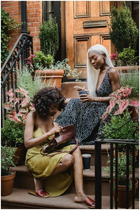 Two women enjoying a serene afternoon on a garden