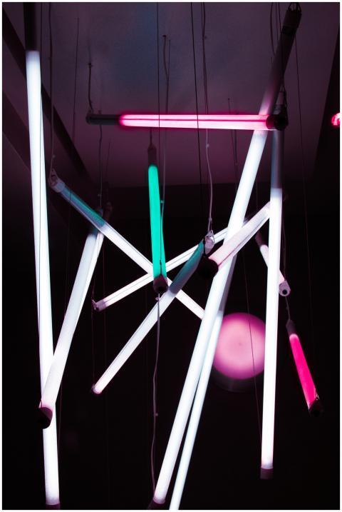 Abstract arrangement of bright neon lights hanging