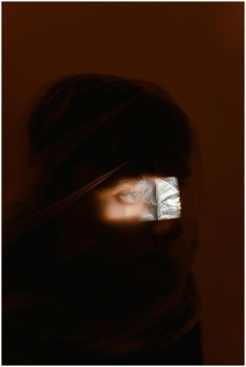 A mysterious and conceptual portrait featuring an