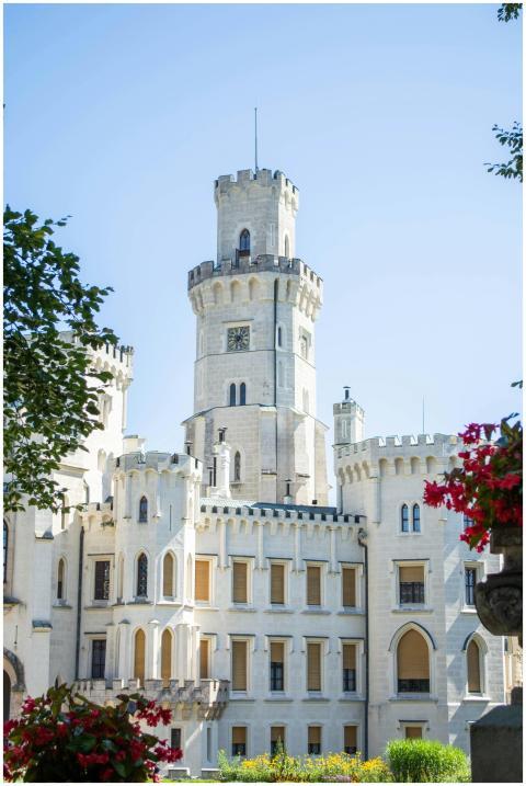 A beautiful historic castle with a floral foregrou