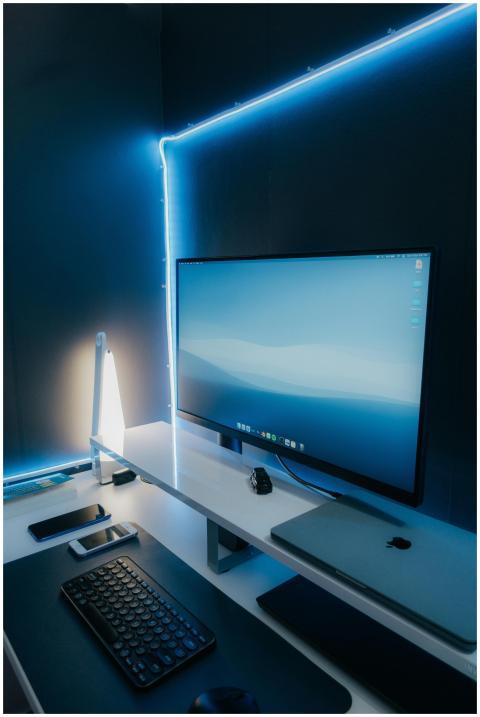 A sleek and modern workspace setup featuring a des