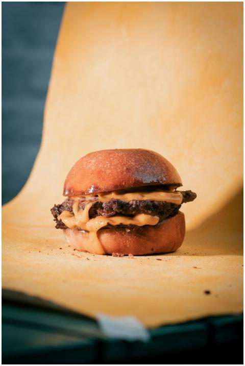 Close-up of a juicy cheeseburger with melted chees