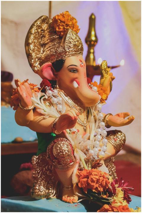 Beautifully adorned Ganesha statue with vibrant fl
