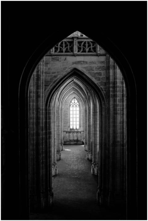 Dramatic black and white photo of a gothic archway