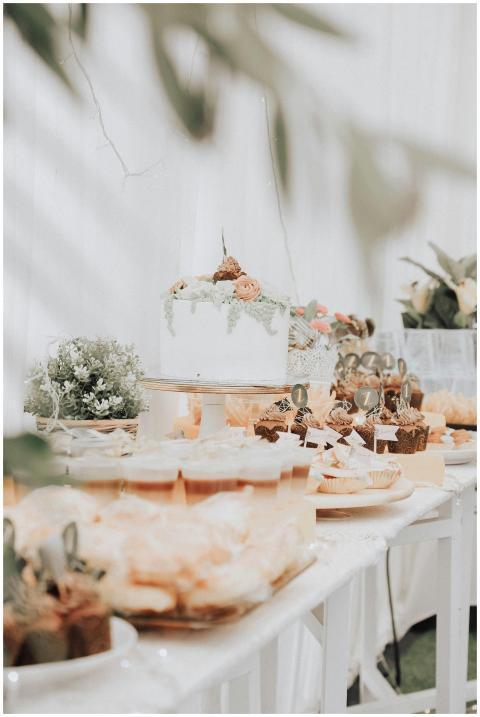 Beautifully arranged dessert table with cakes and