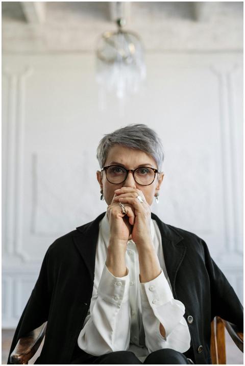 Portrait of a thoughtful woman in a modern office