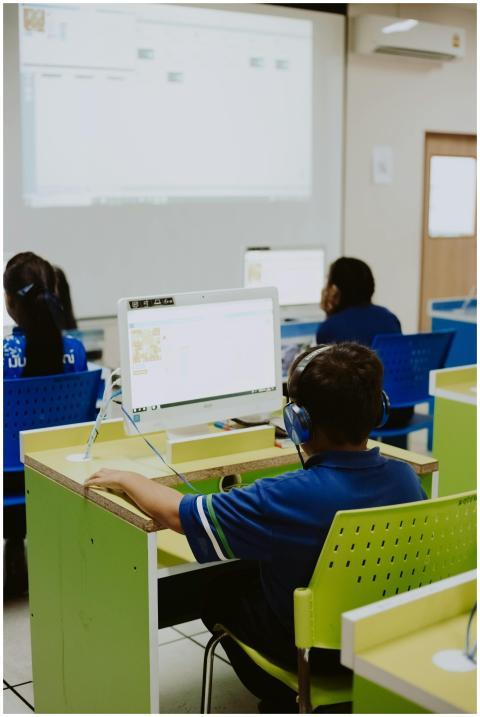 Children engaged in learning at a computer lab, us