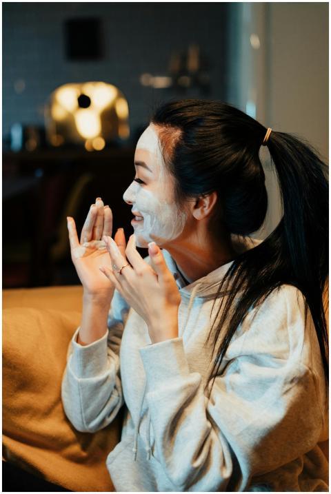 Asian woman relaxing at home with a skincare face