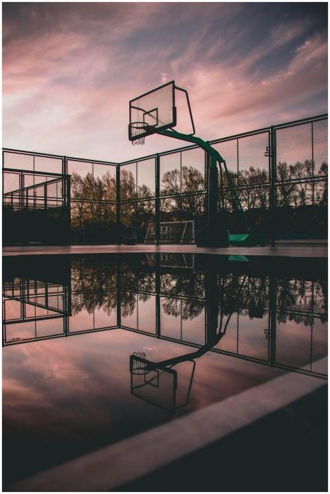 A tranquil view of a basketball court with reflect