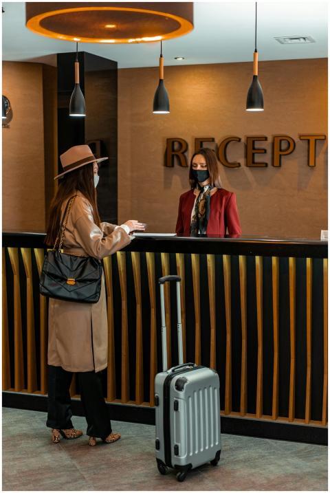 Businesswoman checking into a hotel at a stylish r