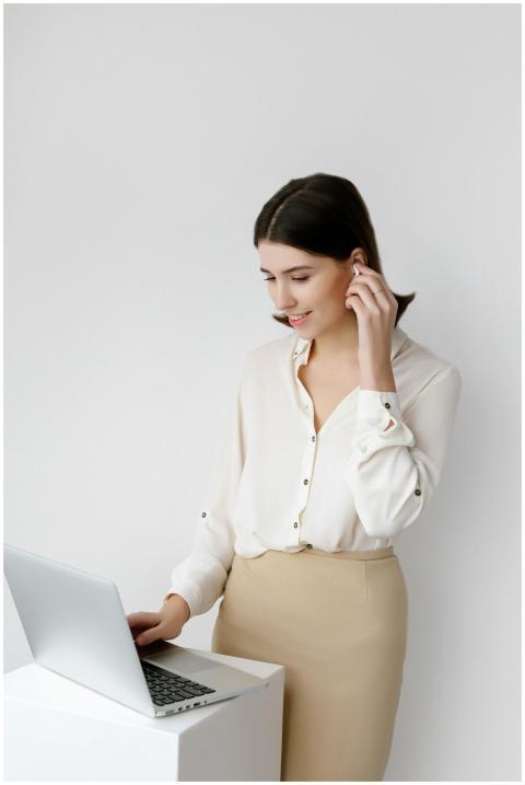 Confident businesswoman in elegant attire working