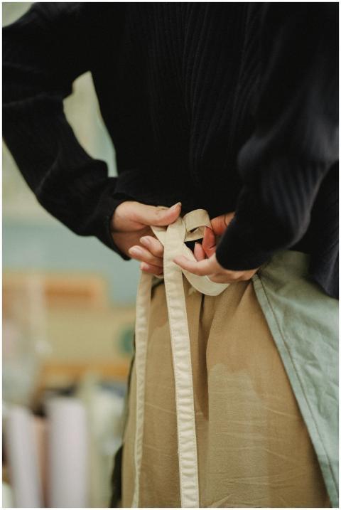 Back view crop anonymous female cafeteria or store