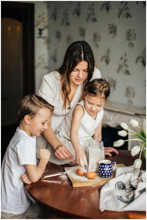 A joyful mother and her two children baking togeth