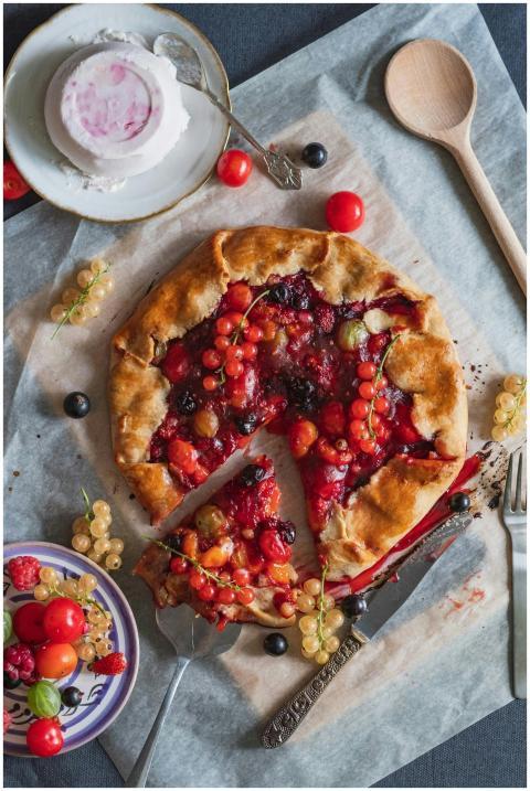 Delicious rustic mixed berry galette with currants